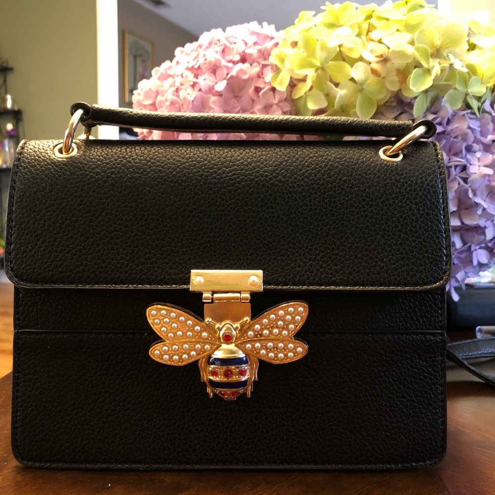 Black faux leather handbag
